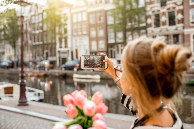 amsterdam woman mobile photo 750x500 1 - Business and Travel: The Ultimate Guide To Your New Jersey Business Trip